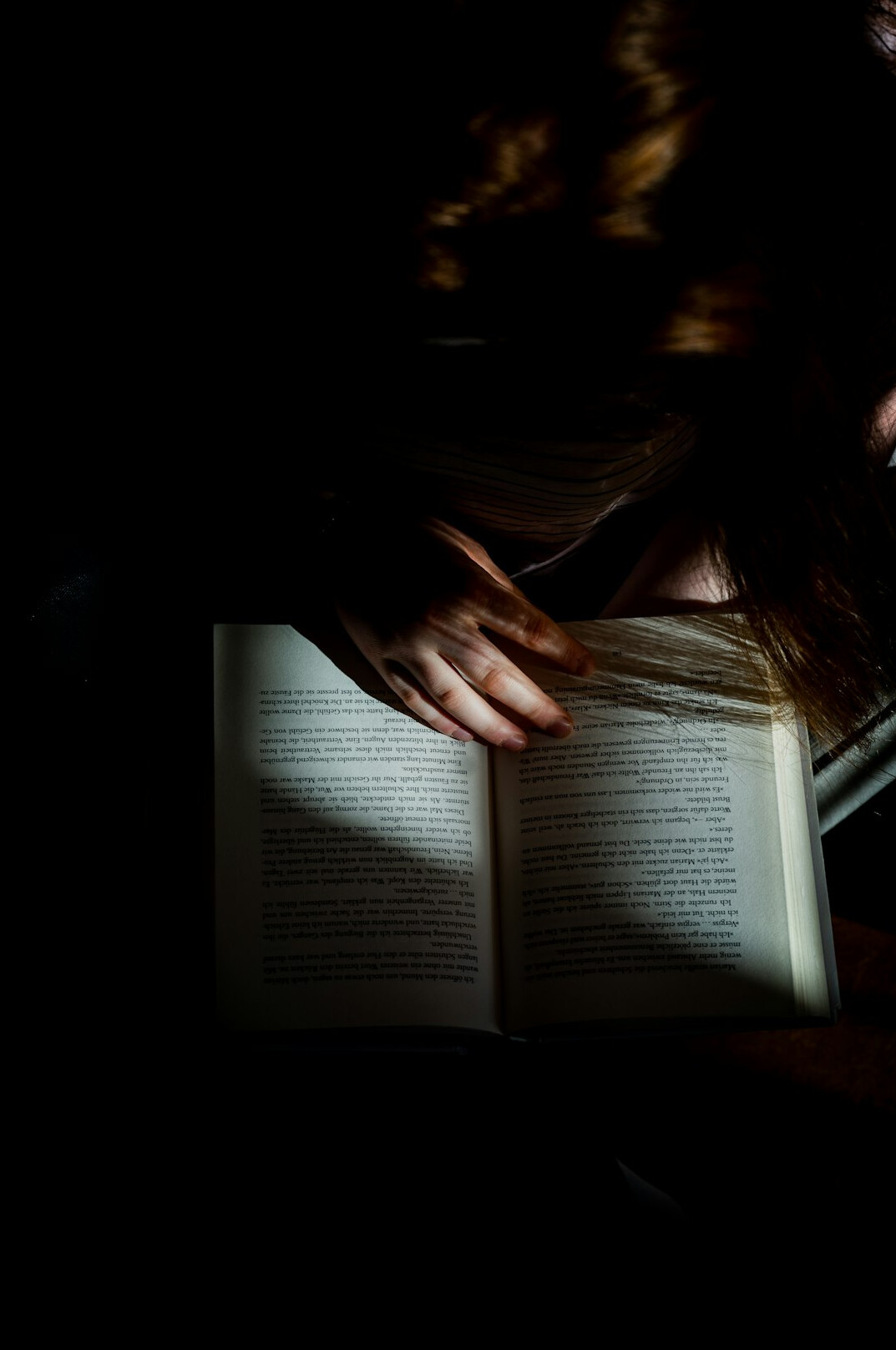 person reading thriller book